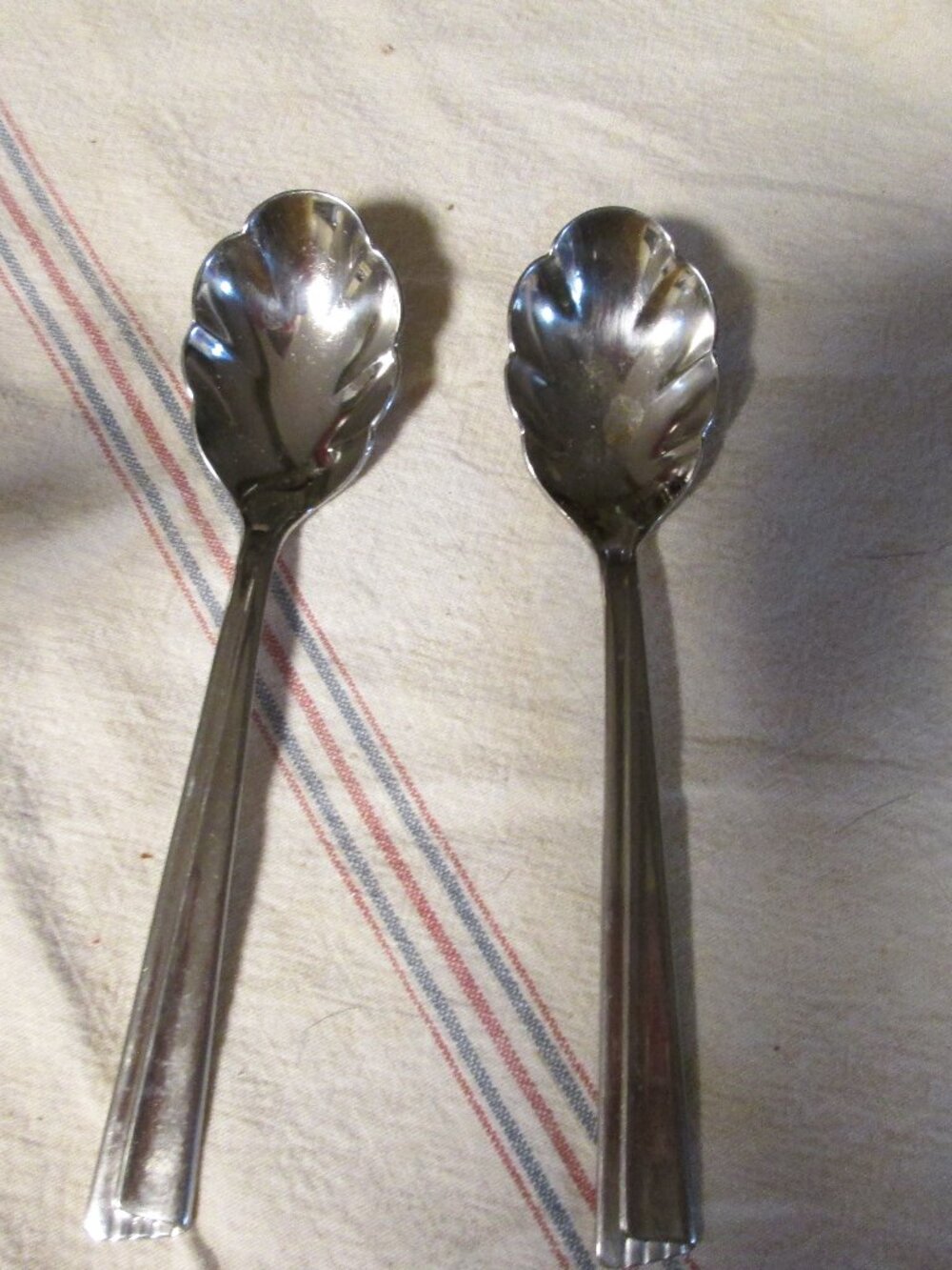 2 vtg Wm Rogers scalloped stainless spoons USA with hallmarks